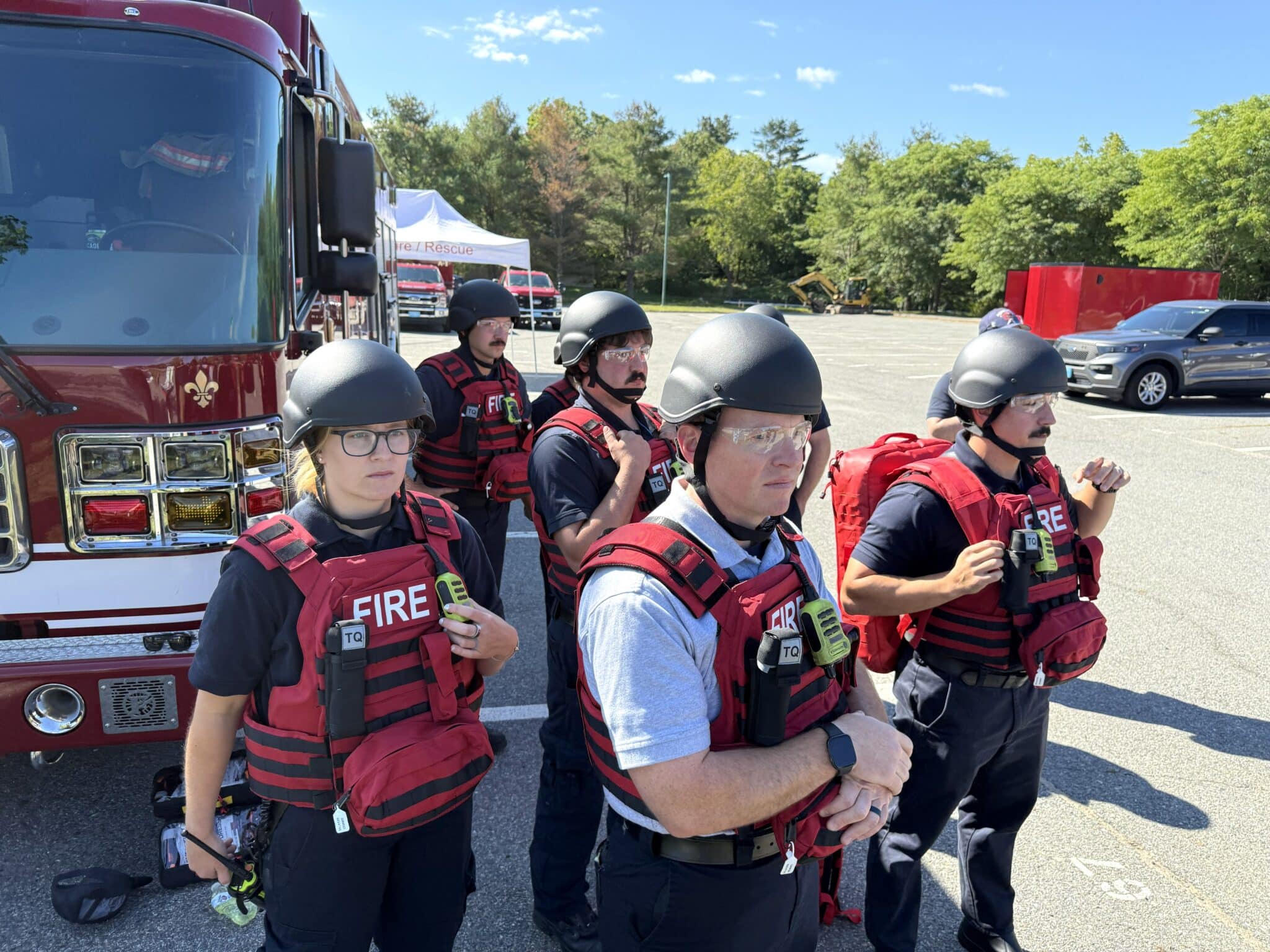 Hopkinton firefighters suited up to take part in a joint training exercise with police and school personnel on Saturday, requiring them to follow police to treat and rescue actors posing as people who were wounded during an active-shooter emergency.
