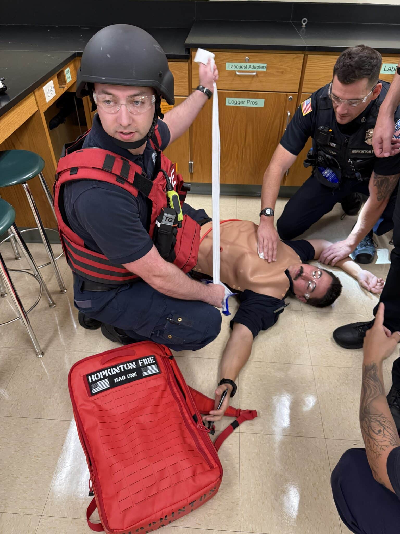 Hopkinton police and firefighters provided treatment to a man acting as a wounded victim during an active-shooter training drill held on Saturday at Hopkinton High School.
